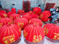 Workers make red lanterns in Handan, China, on December 17, 2024. (