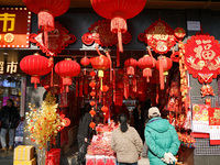 People buy New Year ornaments at Yu Garden Small Commodity Market in Shanghai, China, on December 17, 2024. (