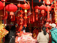 People buy New Year ornaments at Yu Garden Small Commodity Market in Shanghai, China, on December 17, 2024. (