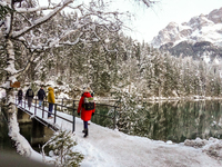 Hikers are at Eibsee in Grainau, Bavaria, Germany, on December 13, 2024. The lake is located 9 km southwest of Garmisch-Partenkirchen below...