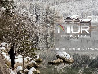 Hikers are at Eibsee in Grainau, Bavaria, Germany, on December 13, 2024. The lake is located 9 km southwest of Garmisch-Partenkirchen below...