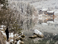 Hikers are at Eibsee in Grainau, Bavaria, Germany, on December 13, 2024. The lake is located 9 km southwest of Garmisch-Partenkirchen below...