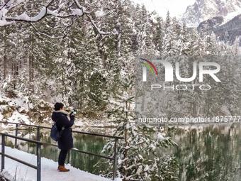 Hikers are at Eibsee in Grainau, Bavaria, Germany, on December 13, 2024. The lake is located 9 km southwest of Garmisch-Partenkirchen below...