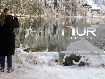 Hikers are at Eibsee in Grainau, Bavaria, Germany, on December 13, 2024. The lake is located 9 km southwest of Garmisch-Partenkirchen below...