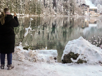 Hikers are at Eibsee in Grainau, Bavaria, Germany, on December 13, 2024. The lake is located 9 km southwest of Garmisch-Partenkirchen below...