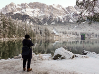 Hikers are at Eibsee in Grainau, Bavaria, Germany, on December 13, 2024. The lake is located 9 km southwest of Garmisch-Partenkirchen below...