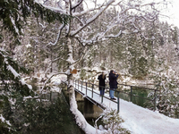 Hikers are at Eibsee in Grainau, Bavaria, Germany, on December 13, 2024. The lake is located 9 km southwest of Garmisch-Partenkirchen below...