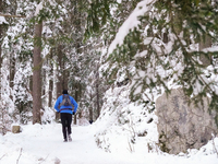 Hikers are at Eibsee in Grainau, Bavaria, Germany, on December 13, 2024. The lake is located 9 km southwest of Garmisch-Partenkirchen below...