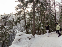 Hikers are at Eibsee in Grainau, Bavaria, Germany, on December 13, 2024. The lake is located 9 km southwest of Garmisch-Partenkirchen below...