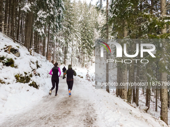 Hikers are at Eibsee in Grainau, Bavaria, Germany, on December 13, 2024. The lake is located 9 km southwest of Garmisch-Partenkirchen below...