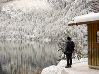 Hikers are at Eibsee in Grainau, Bavaria, Germany, on December 13, 2024. The lake is located 9 km southwest of Garmisch-Partenkirchen below...