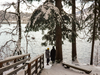 Hikers are at Eibsee in Grainau, Bavaria, Germany, on December 13, 2024. The lake is located 9 km southwest of Garmisch-Partenkirchen below...