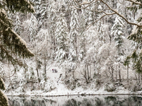 Hikers are at Eibsee in Grainau, Bavaria, Germany, on December 13, 2024. The lake is located 9 km southwest of Garmisch-Partenkirchen below...