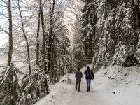 Hikers are at Eibsee in Grainau, Bavaria, Germany, on December 13, 2024. The lake is located 9 km southwest of Garmisch-Partenkirchen below...