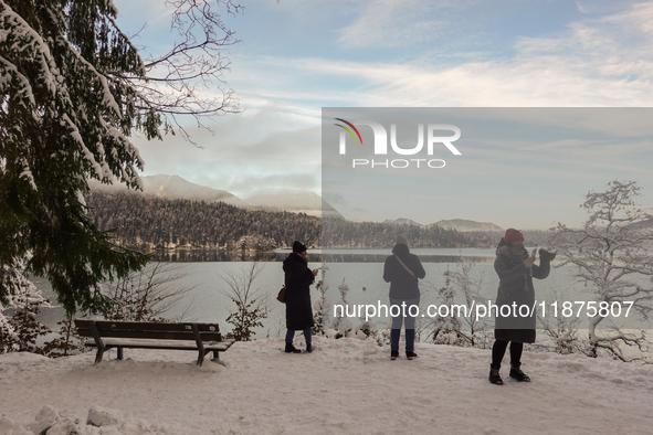 Hikers are at Eibsee in Grainau, Bavaria, Germany, on December 13, 2024. The lake is located 9 km southwest of Garmisch-Partenkirchen below...