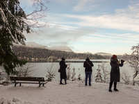 Hikers are at Eibsee in Grainau, Bavaria, Germany, on December 13, 2024. The lake is located 9 km southwest of Garmisch-Partenkirchen below...