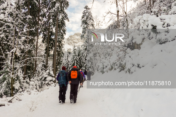 Hikers are at Eibsee in Grainau, Bavaria, Germany, on December 13, 2024. The lake is located 9 km southwest of Garmisch-Partenkirchen below...