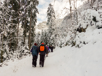 Hikers are at Eibsee in Grainau, Bavaria, Germany, on December 13, 2024. The lake is located 9 km southwest of Garmisch-Partenkirchen below...