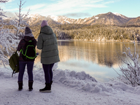 Hikers are at Eibsee in Grainau, Bavaria, Germany, on December 13, 2024. The lake is located 9 km southwest of Garmisch-Partenkirchen below...