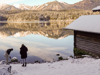 Hikers are at Eibsee in Grainau, Bavaria, Germany, on December 13, 2024. The lake is located 9 km southwest of Garmisch-Partenkirchen below...