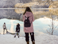 Hikers are at Eibsee in Grainau, Bavaria, Germany, on December 13, 2024. The lake is located 9 km southwest of Garmisch-Partenkirchen below...