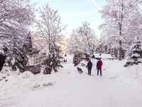 Hikers are at Eibsee in Grainau, Bavaria, Germany, on December 13, 2024. The lake is located 9 km southwest of Garmisch-Partenkirchen below...