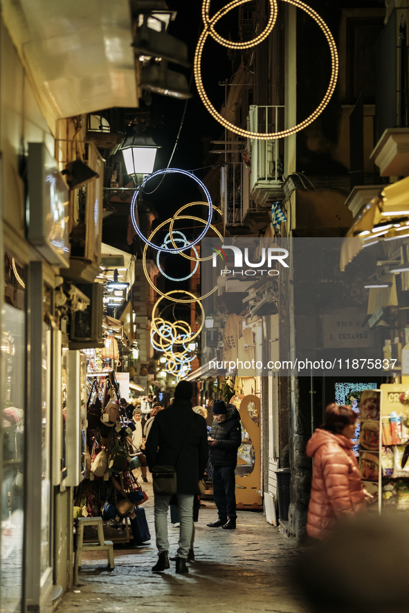 Christmas lights adorn a small alley in Sorrento, Naples, Italy, on December 16, 2024. Sorrento is a town overlooking the Bays of Naples in...