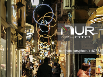 Christmas lights adorn a small alley in Sorrento, Naples, Italy, on December 16, 2024. Sorrento is a town overlooking the Bays of Naples in...