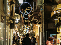 Christmas lights adorn a small alley in Sorrento, Naples, Italy, on December 16, 2024. Sorrento is a town overlooking the Bays of Naples in...