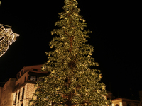 A large Christmas tree lights up Piazza Torquato Tasso in Sorrento, Naples, Italy, on December 16, 2024. Sorrento is a town overlooking the...