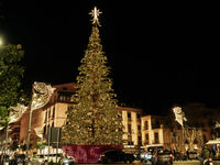 A large Christmas tree lights up Piazza Torquato Tasso in Sorrento, Naples, Italy, on December 16, 2024. Sorrento is a town overlooking the...