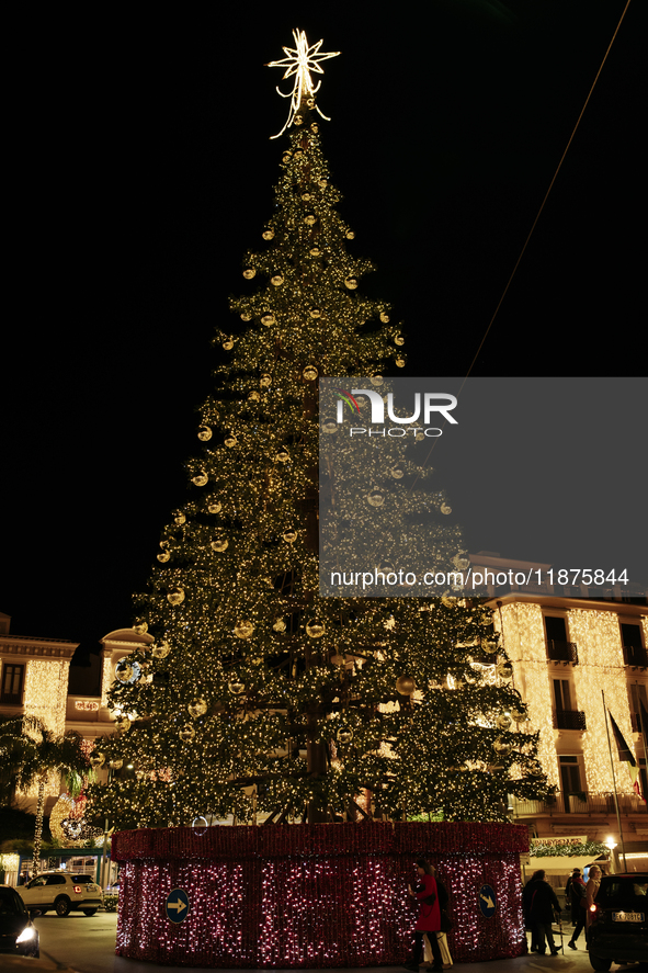 A large Christmas tree adorns Piazza Torquato Tasso in Sorrento, Naples, Italy, on December 16, 2024. Sorrento is a town overlooking the Bay...