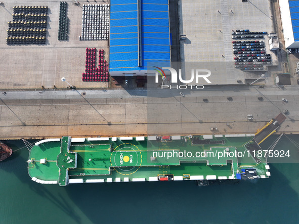 A ro-ro ship loads export vehicles at a port in Lianyungang, China, on December 18, 2024. 