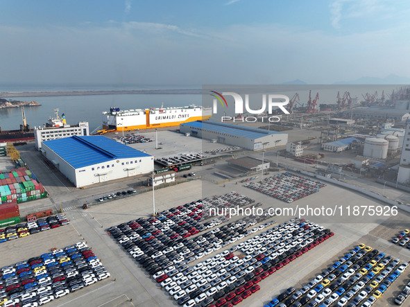 A ro-ro ship loads export vehicles at a port in Lianyungang, China, on December 18, 2024. 