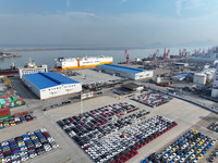 A ro-ro ship loads export vehicles at a port in Lianyungang, China, on December 18, 2024. (