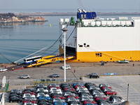 A ro-ro ship loads export vehicles at a port in Lianyungang, China, on December 18, 2024. (