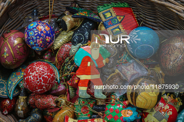 Christmas ornaments are ready at the workshop before being sent to the market ahead of Christmas celebrations in Srinagar, Jammu and Kashmir...