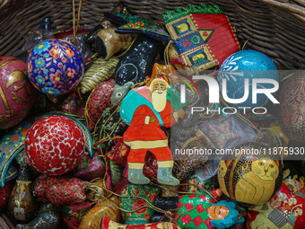 Christmas ornaments are ready at the workshop before being sent to the market ahead of Christmas celebrations in Srinagar, Jammu and Kashmir...