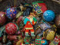 Christmas ornaments are ready at the workshop before being sent to the market ahead of Christmas celebrations in Srinagar, Jammu and Kashmir...