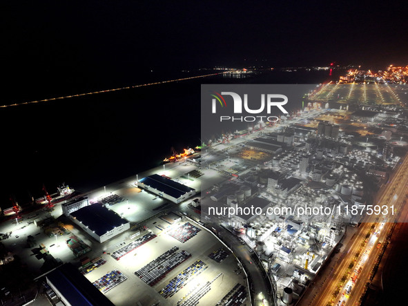 A photo taken on the evening of December 18, 2024, shows the working scene of the terminal at Lianyungang Port in Lianyungang, China, on Dec...