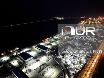 A photo taken on the evening of December 18, 2024, shows the working scene of the terminal at Lianyungang Port in Lianyungang, China, on Dec...