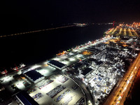 A photo taken on the evening of December 18, 2024, shows the working scene of the terminal at Lianyungang Port in Lianyungang, China, on Dec...