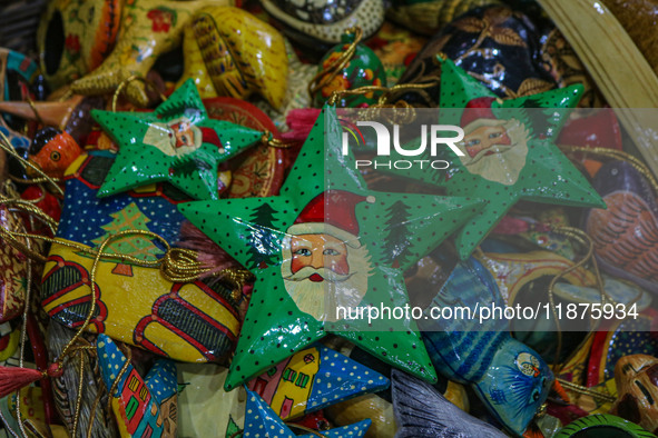 Christmas ornaments are ready at the workshop before being sent to the market ahead of Christmas celebrations in Srinagar, Jammu and Kashmir...