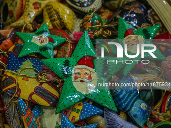 Christmas ornaments are ready at the workshop before being sent to the market ahead of Christmas celebrations in Srinagar, Jammu and Kashmir...