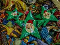 Christmas ornaments are ready at the workshop before being sent to the market ahead of Christmas celebrations in Srinagar, Jammu and Kashmir...