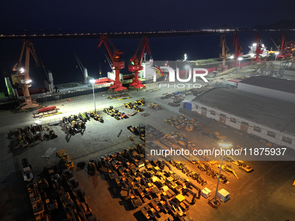 A photo taken on the evening of December 18, 2024, shows the working scene of the terminal at Lianyungang Port in Lianyungang, China, on Dec...