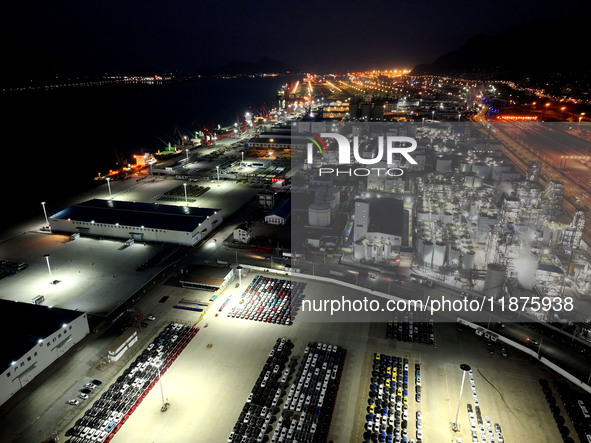 A photo taken on the evening of December 18, 2024, shows the working scene of the terminal at Lianyungang Port in Lianyungang, China, on Dec...