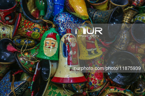 Christmas ornaments are ready at the workshop before being sent to the market ahead of Christmas celebrations in Srinagar, Jammu and Kashmir...