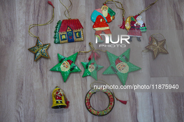 Christmas ornaments are ready at the workshop before being sent to the market ahead of Christmas celebrations in Srinagar, Jammu and Kashmir...