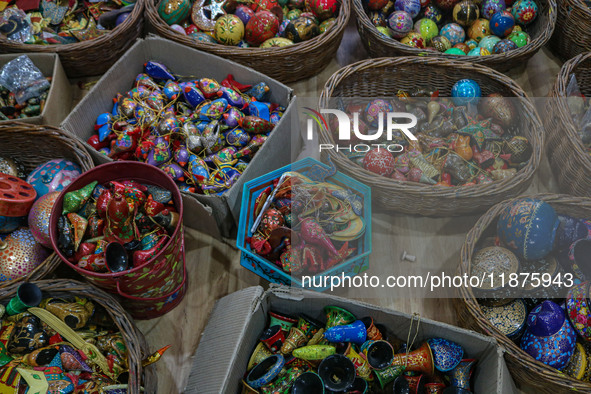 Christmas ornaments are ready at the workshop before being sent to the market ahead of Christmas celebrations in Srinagar, Jammu and Kashmir...